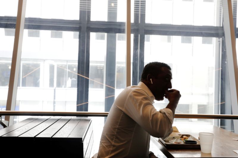 A customer eats inside of a Shake Shack store in New York, U.S., September 27, 2017. REUTERS/Lucas Jackson