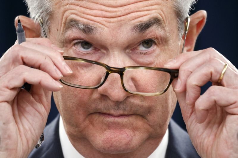 Federal Reserve Chair Jerome Powell removes his glasses as he listens to a question during a news conference after the Federal Open Market Committee meeting, Wednesday, Dec. 11, 2019, in Washington. The Federal Reserve is leaving its benchmark interest rate alone and signaling that it expects to keep low rates unchanged through next year. (AP Photo/Jacquelyn Martin)