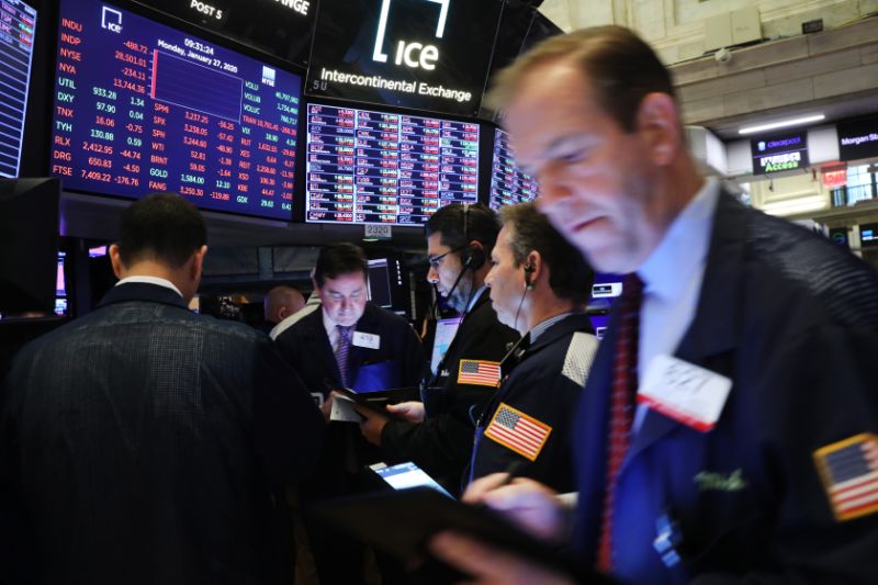 NEW YORK, NEW YORK - JANUARY 27: Traders work on the floor of the New York Stock Exchange (NYSE) on January 27, 2020 in New York City. U.S. stocks fell sharply in morning trading as fears over the spreading coronavirus continue to unsettle global markets. The Dow Jones Industrial Average fell over 400 points after the Opening Bell. (Photo by Spencer Platt/Getty Images)