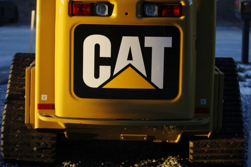 The CAT logo is seen on the back of a Caterpillar machine on a lot at Milton CAT in North Reading, Massachusetts January 23, 2013. Caterpillar, the world's largest maker of tractors and excavators, took a $580 million charge last week as a result of "accounting misconduct" at a unit of a Chinese mining equipment company it bought last year. REUTERS/Jessica Rinaldi (UNITED STATES - Tags: BUSINESS CONSTRUCTION LOGO)