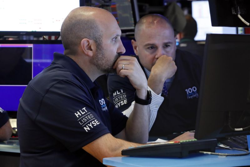 Specialists James Denaro, left, and Mario Picone work on the floor of the New York Stock Exchange, Wednesday, May 29, 2019. Stocks are getting off to a weak start on Wall Street led by drops in technology and health care companies. (AP Photo/Richard Drew)