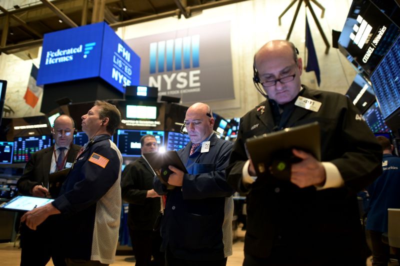 Traders work during the opening bell at the New York Stock Exchange (NYSE) on February 3, 2020 at Wall Street in New York City. - Wall Street stocks rose early Monday, bouncing after Friday's rout as markets monitored the coronavirus at the start of a week with key economic data and earnings reports. The Dow suffered the worst losses of the year on Friday as the death toll from the virus continued to climb and the ailment spread to additional countries. (Photo by Johannes EISELE / AFP) (Photo by JOHANNES EISELE/AFP via Getty Images)