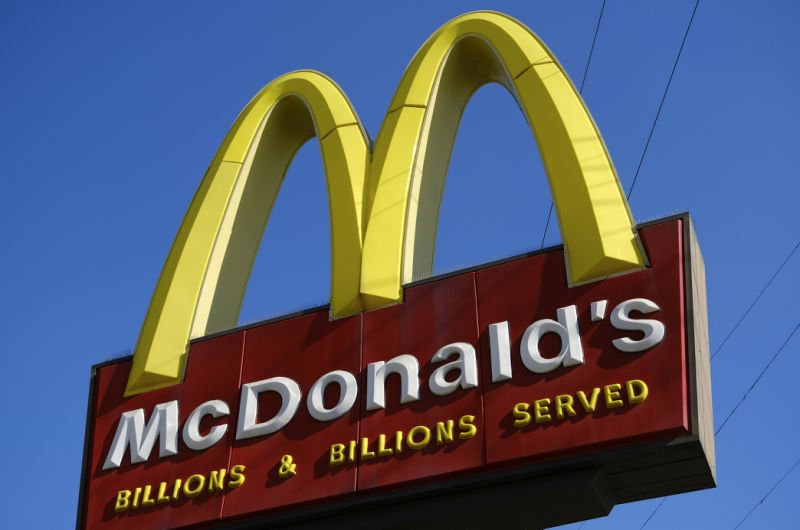 FILE - This Nov. 25, 2019, file photo shows McDonald's sign above the fast food restaurant near downtown Los Angeles. The Labor Department issued a final rule Sunday, Jan. 12, 2020, that clarifies when a worker is employed by more than one company, an issue that affects franchise businesses such as McDonald's and firms that have outsourced services such as cleaning and maintenance. (AP Photo/Richard Vogel, File)