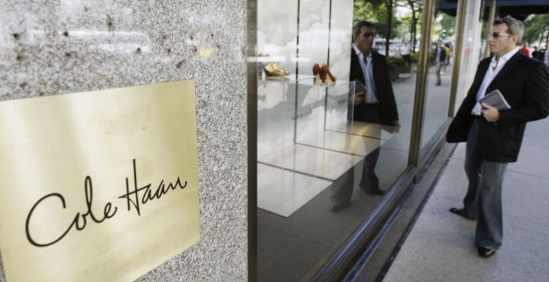 A man checks out the shoe display at the Cole Haan store on Chicago's Michigan Ave., Friday, Aug. 31, 2007. The Commerce Department reported Friday that consumer spending rose by 0.4 percent in July, double the June increase. The spending was supported by a solid 0.5 percent rise in incomes, the best showing in this area in four months. (AP Photo/M. Spencer Green)