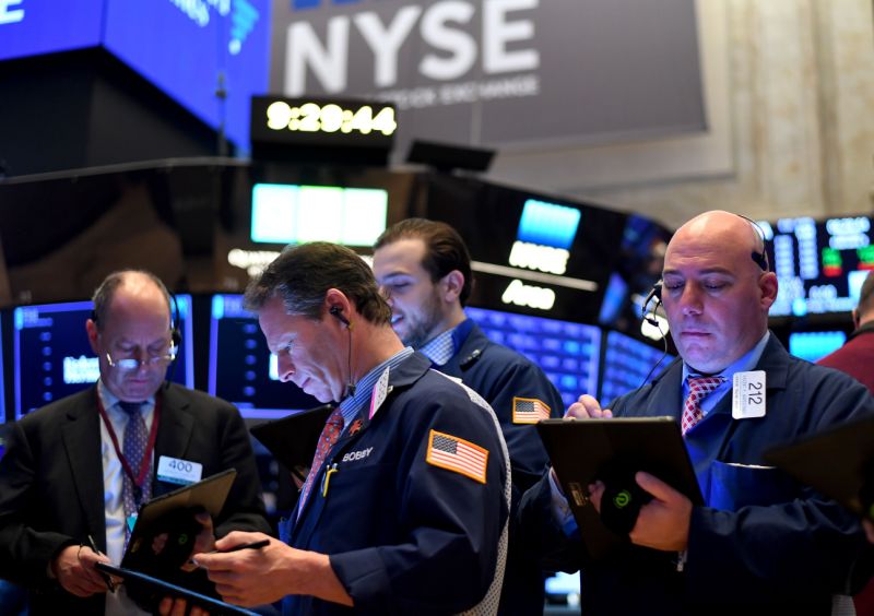 Traders work during the opening bell at the New York Stock Exchange (NYSE) on February 3, 2020 at Wall Street in New York City. - Wall Street stocks rose early Monday, bouncing after Friday's rout as markets monitored the coronavirus at the start of a week with key economic data and earnings reports. The Dow suffered the worst losses of the year on Friday as the death toll from the virus continued to climb and the ailment spread to additional countries. (Photo by Johannes EISELE / AFP) (Photo by JOHANNES EISELE/AFP via Getty Images)