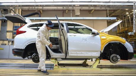 An employee works on an assembly line at Dongfeng Honda in Wuhan.