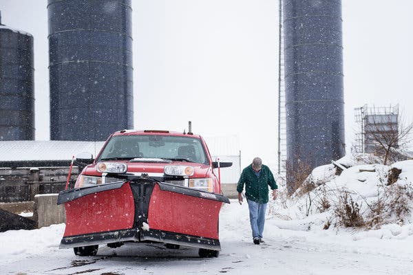 A farmer in in Polo, Ill., last month, near silos where he feeds cattle.