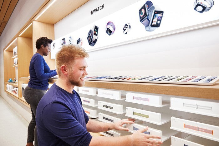 An assortment of watch bands near an Apple Watch display in the Apple store.