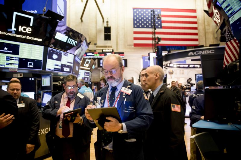 NEW YORK, March 16, 2020 -- Traders work on the floor at the New York Stock Exchange in New York, the United States, March 16, 2020. U.S. stocks opened sharply lower on Monday even after the Federal Reserve cut its benchmark interest rate to the range from 0 to 0.25 percent and unveiled a huge program of bond-buying amid coronavirus fallout. The S&P 500 index declined 8 percent shortly after the opening bell, triggering a key circuit breaker that halted trading for 15 minutes. It was the third time that the circuit breakers, or trading halts, have been tipped since last week. (Photo by Michael Nagle/Xinhua via Getty) (Xinhua/Michael Nagle via Getty Images)