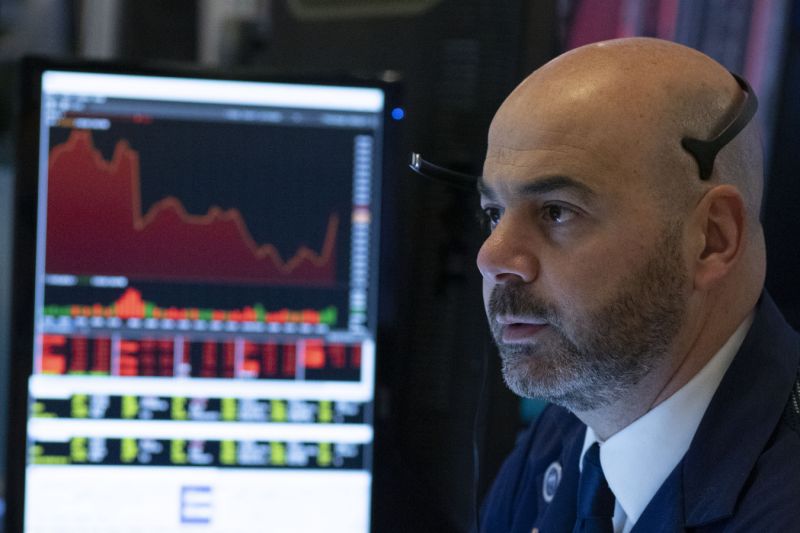 Trader Federico DeMarco works at the New York Stock Exchange, Wednesday, March 18, 2020 in New York. Major U.S. stock indexes closed sharply lower on Wall Street Wednesday as fears of a prolonged coronavirus-induced recession took hold. The Dow industrials lost more than 1,300 points, or 6.3%. After a brutal few weeks, the Dow has now lost nearly all of its gains since President Trump's inauguration. (AP Photo/Mark Lennihan)