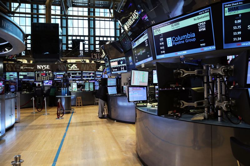 NEW YORK, NY - JULY 08: Traders wait on a nearly empty trading floor at the New York Stock Exchange (NYSE) after trading was halted due to a "technical glitch" on July 8, 2015 in New York City. Trading was to resume in the afternoon. (Photo by Spencer Platt/Getty Images)