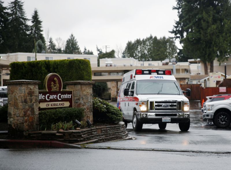 An ambulance drives away with a resident at the Life Care Center of Kirkland, a long-term care facility linked to several confirmed coronavirus cases, in Kirkland, Washington, U.S. March 6, 2020. REUTERS/Lindsey Wasson?