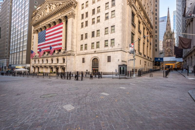 Residents of New York City has been requested to stay at home during the Coronavirus pandemic resulting in the streets looking deserted. A landscape view of the deserted looking NYSE on a Wednesday afternoon. The Trinity Church is seen at the background. Most churches are still open for public access. Usually this place gets crowded at this time of the day and week.