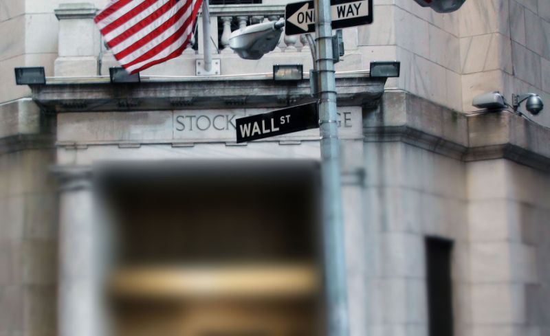 Wall Street Sign With US Flag In Manhattan New York City United States Of America