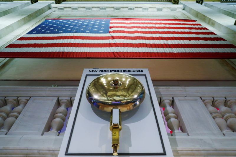 The bell used to open and close the markets hangs in front of an empty podium above the floor of the New York Stock Exchange (NYSE) as it prepares to close due to the coronavirus disease (COVID-19) outbreak in New York, U.S., March 20, 2020. REUTERS/Lucas Jackson TPX IMAGES OF THE DAY