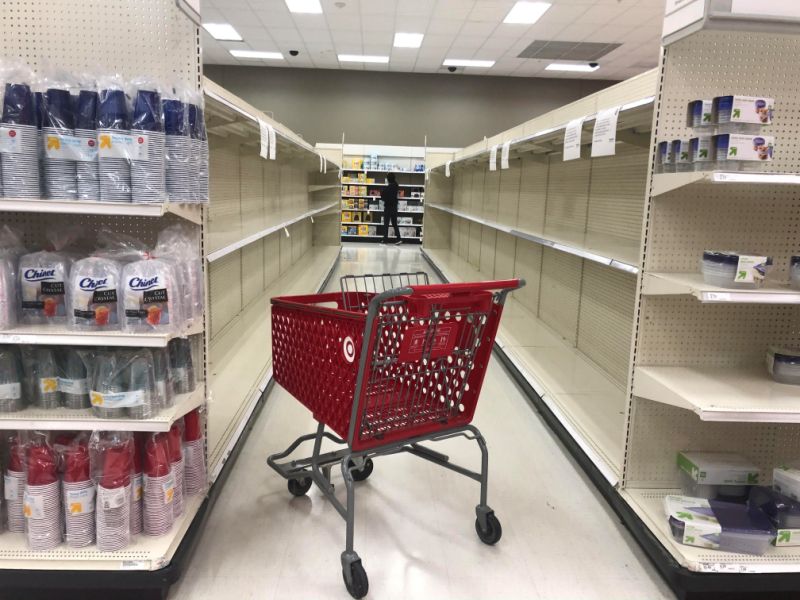 An abandoned shopping cart lies between empty paper towel aisles during coronavirus disease (COVID-19) related hoarding at a Target store in Culver City, California, U.S., April 2, 2020. Picture taken April 2, 2020. REUTERS/Lisa Baertlein