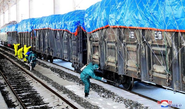 Disinfecting a freight train in Sinuiju, North Korea, on the Chinese border, in a photo released in March by North Korean state media.