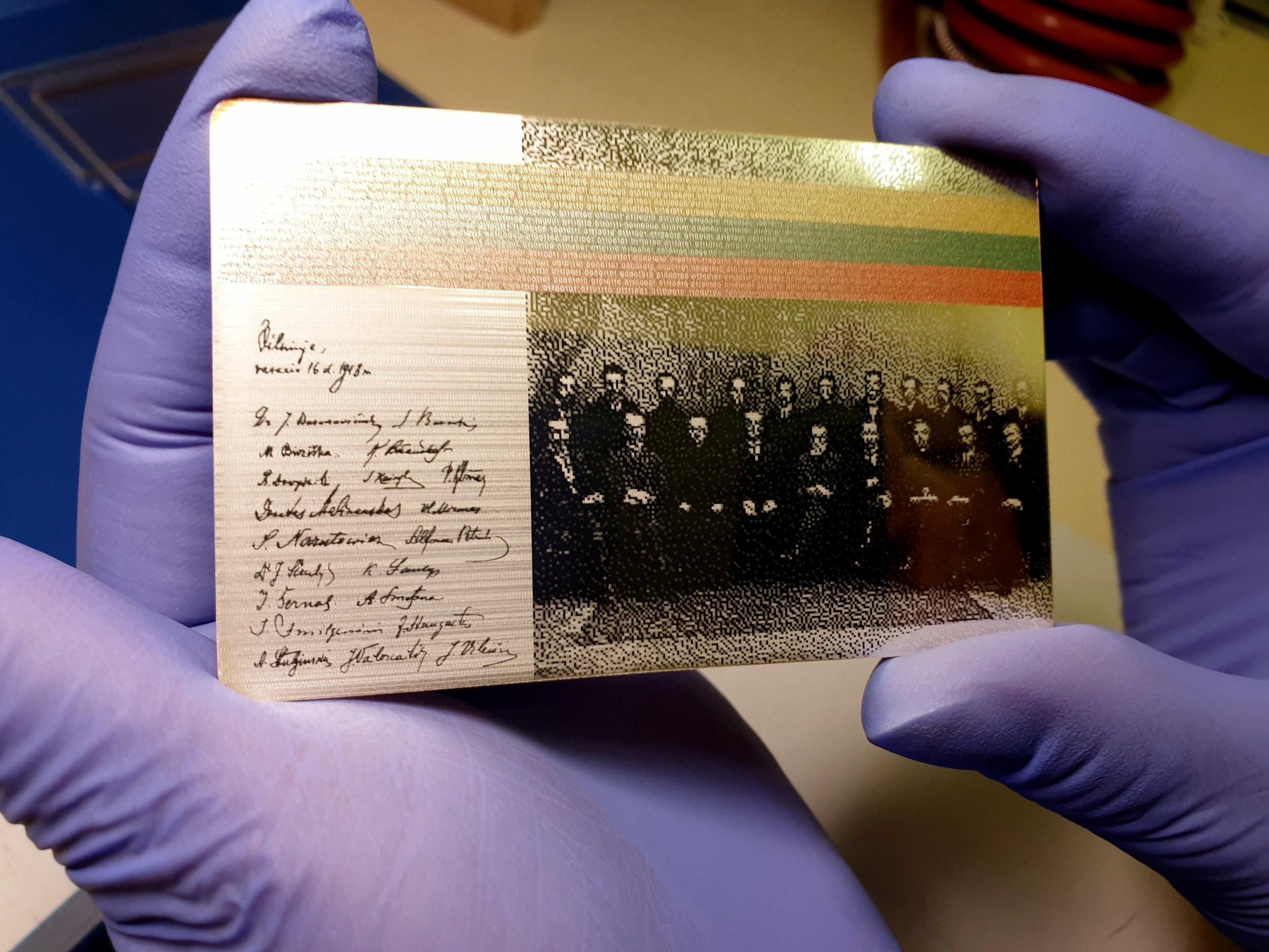 A worker at the Lithuanian mint holds a silver coin, produced to be exchanged for sets of digital currency released by Lithuanian central bank in Vilnius, Lithuania June 1, 2020. Lithuania is about to issue the first central bank-produced digital coin in the euro zone, part of a project to trial state-backed digital currencies and blockchain technology in everyday use. Picture taken June 1, 2020. REUTERS/Andrius Sytas