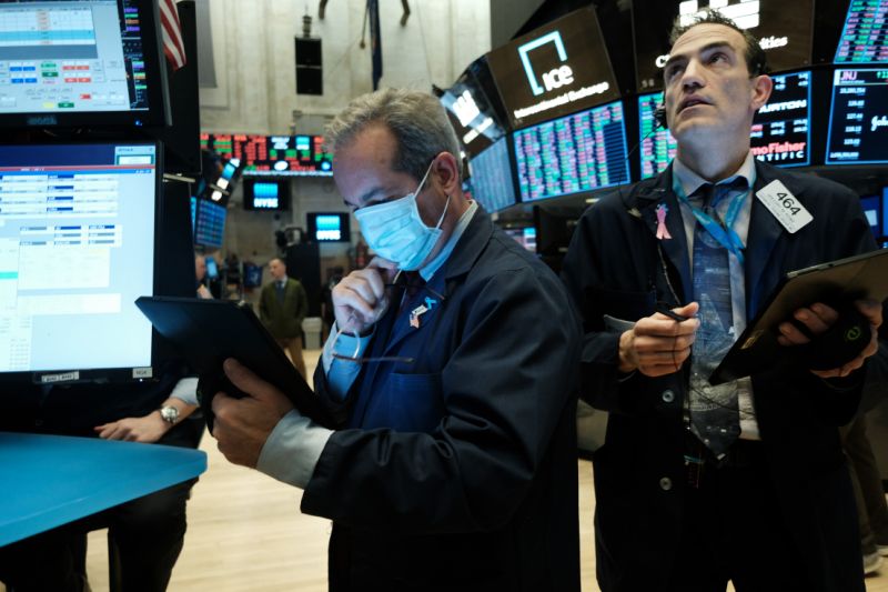 NEW YORK, NEW YORK - MARCH 20: Traders, some in medical masks, work on the floor of the New York Stock Exchange (NYSE) on March 20, 2020 in New York City. Trading on the floor will temporarily become fully electronic starting on Monday to protect employees from spreading the coronavirus. The Dow fell over 500 points on Friday as investors continue to show concerns over COVID-19. (Photo by Spencer Platt/Getty Images)