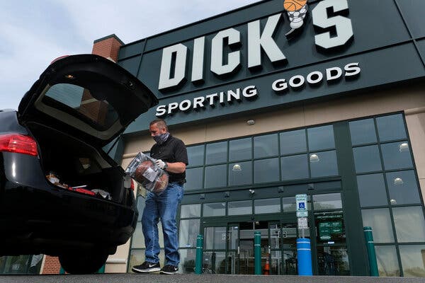 Gus Promollo delivers an order into a customer's trunk at Dick's Sporting Goods in Paramus, N.J.