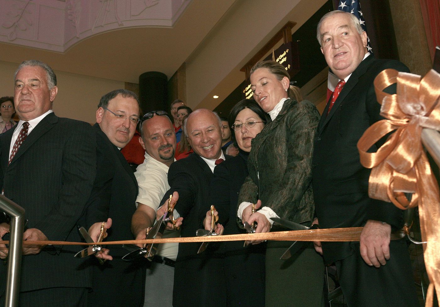 Louis DeNaples (right) with his daughter, Lisa DeNaples and invited guests during a ribbon-cutting at Mount Airy Casino Resort in 2007.