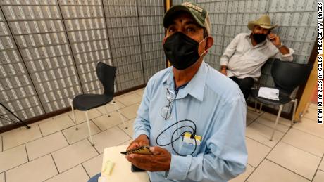 Fernando Fausto, 59, a resident Mexicali, appears at a private service agency to file for unemployment on July 1, 2020 in Calexico, Calif.