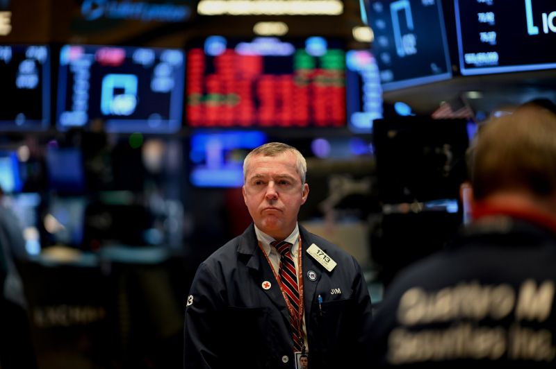 Traders work during the opening bell at the New York Stock Exchange (NYSE) on March 16, 2020 at Wall Street in New York City. - Trading on Wall Street was halted immediately after the opening bell Monday, as stocks posted steep losses following emergency moves by the Federal Reserve to try to avert a recession due to the coronavirus pandemic.Just after the opening bell, the S&P 500 was at 2,490.47, a drop of 8.1 percent and beyond the seven percent loss that automatically triggers a 15-minute trading halt. (Photo by Johannes EISELE / AFP) (Photo by JOHANNES EISELE/AFP via Getty Images)