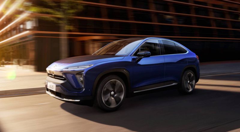 A blue NIO EC6, a sporty electric SUV.