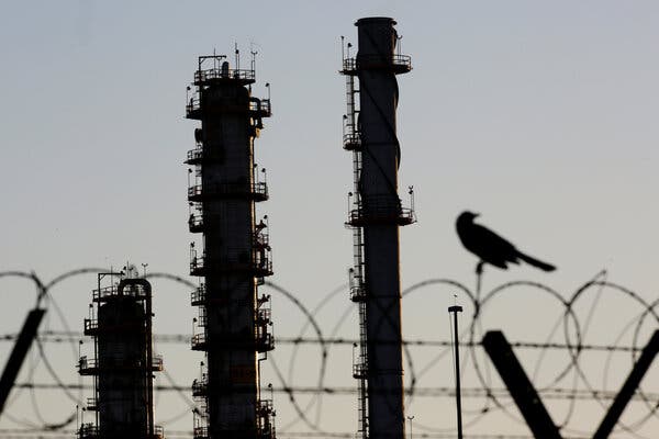 A refinery near Monterrey, Mexico. The International Energy Agency forecast significant declines in oil demand and carbon-dioxide emissions this year.