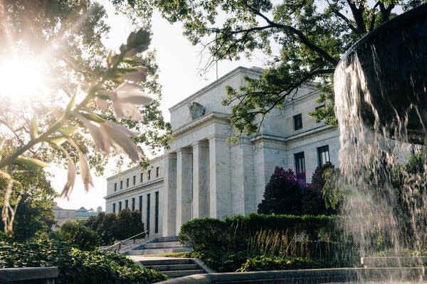 The Federal Reserve building in Washington. Fed officials said the recovery could be slower that expected if additional stimulus measures were not passed, according to the minutes of their last meeting.