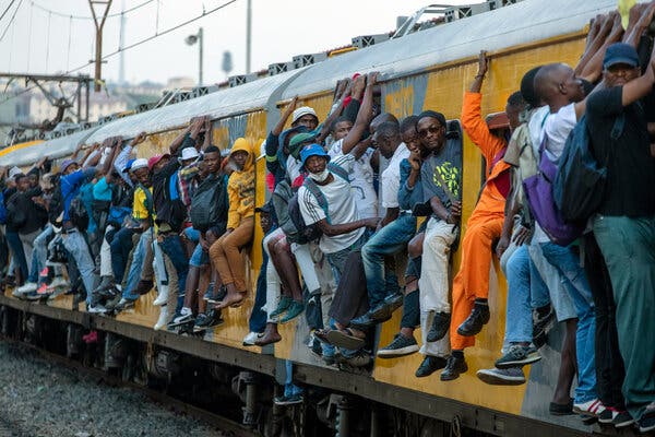 An overcrowded commuter train in Soweto, South Africa. The World Bank expects the global poverty rate to rise this year.