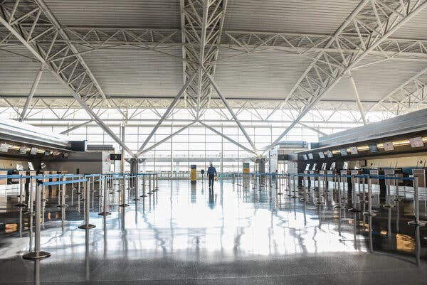 An empty terminal at Kennedy International Airport in New York. Airlines are expected to shed more jobs if Congress does not pass a new stimulus package.